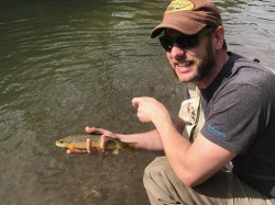 Mat with a summer hopper eating trout.